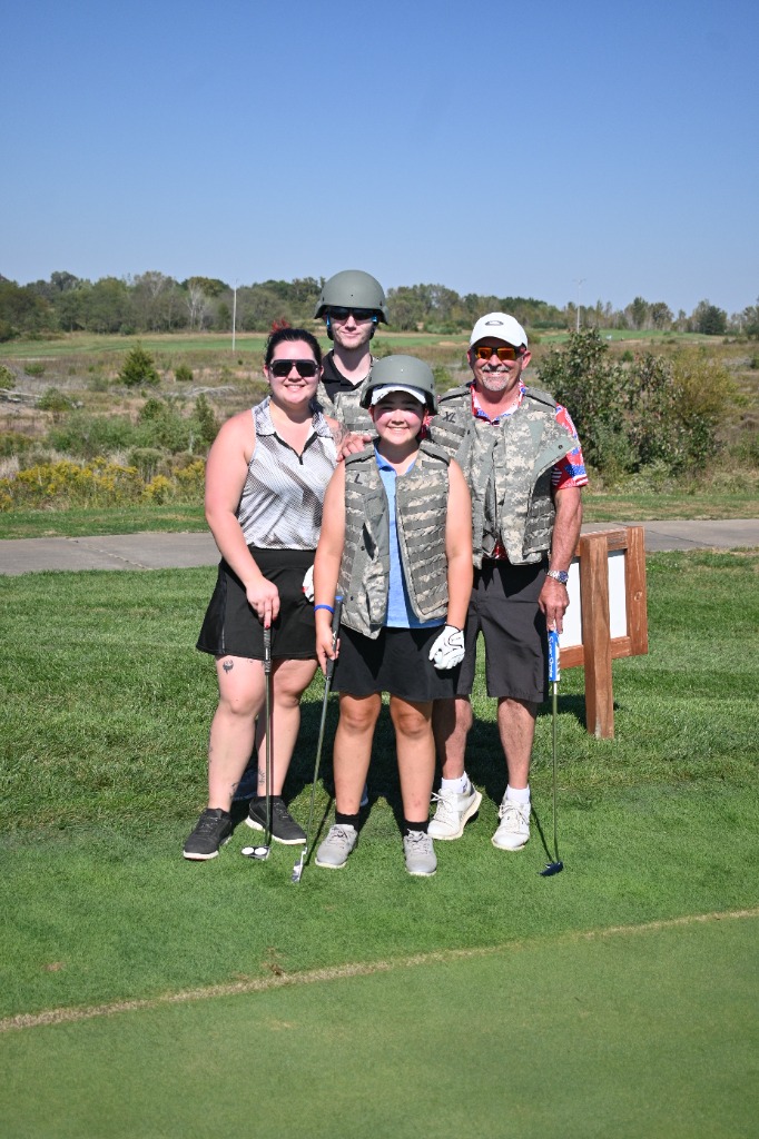 Multi-generational family enjoying a day on the golf course