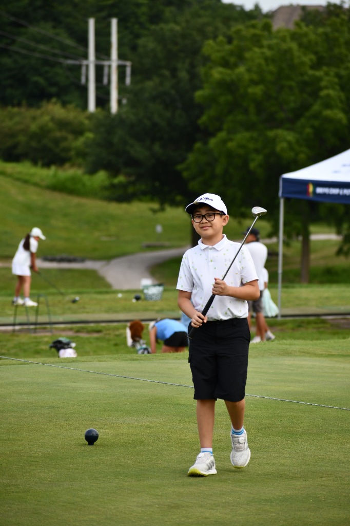 Young junior golfer with driver at Drive Chip and Putt qualifier