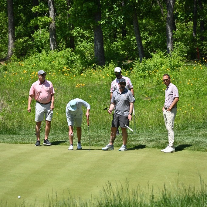 Midwest PGA golfers on the putting green enjoying a tournament round