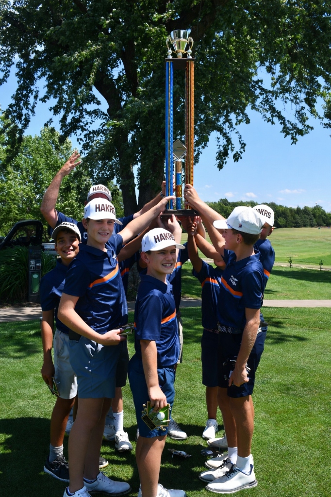 PGA Junior League team celebrating with championship trophy
