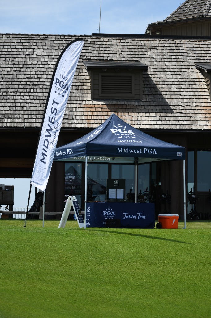 Midwest PGA Junior Tour tournament tent and banner setup on the course
